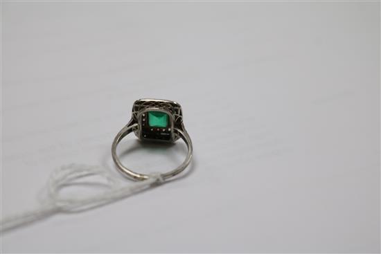 A white metal, emerald and diamond tablet cluster ring, size K.